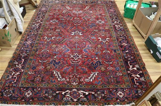 A Persian red ground rug 285 x 190cm